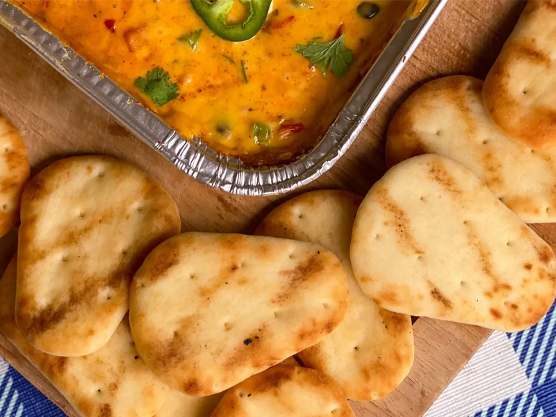 Campfire Queso with Naan Dippers